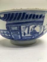 A Chinese blue and white bowl decorated with figur