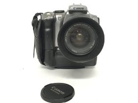 A Canon EOS 300D camera with a Canon 28-90mm EW-60