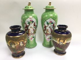 Two pairs of Oriental vases, tallest approx 32.5cm. Shipping category D.