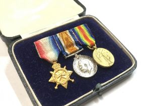 A miniature WW1 medal set, postage category A