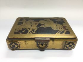A Secessionist style brass card box. The hinged lid decorated with knights in armour, approx 23cm