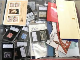 A large collection of unused mint stamps, books an