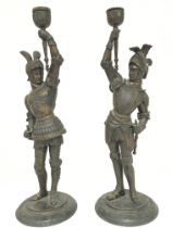 A pair of Spelter knight candlesticks, 38cm postag