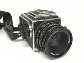 A Hasselblad 500 C/M camera in a fitted case. Post