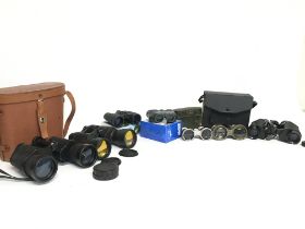 A collection of vintage binoculars, some cased inc