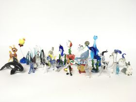 A collection of small art glass animals , no obvio