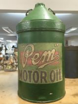 A vintage green Pem 5 gallon oil can