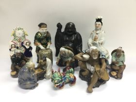 A collection of mainly Oriental figures. Shipping