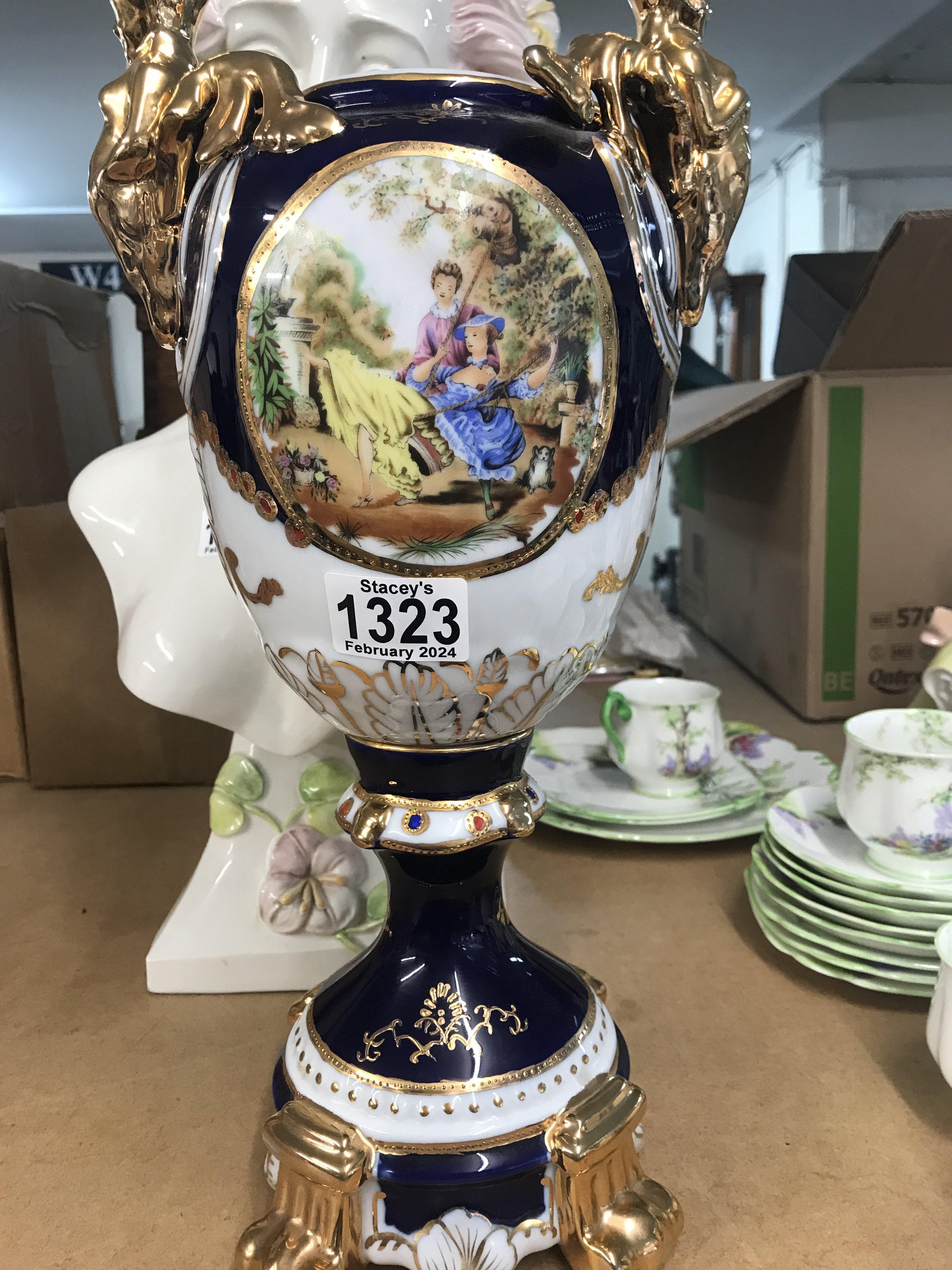 A Vienna style twin handle vase decorated with fig