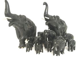 Ebonised wooden elephant figures, heights ranging