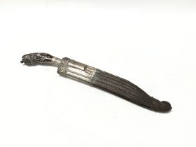 A unusual white metal and carved wood dagger, possibly 18th century with a shape and decorative