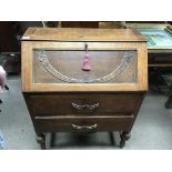 A 1940s oak drop front bureau. 75cm x 97cm x 40cm.