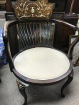 A Edwardian open armchair with inlay the upholstered seat on cabriole legs .