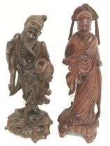 19th century wooden carvings of oriental figures.