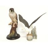A hawk figure and a Franklin Mint ceramic gull fig