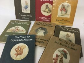 A collection of eight Beatrix Potter books.