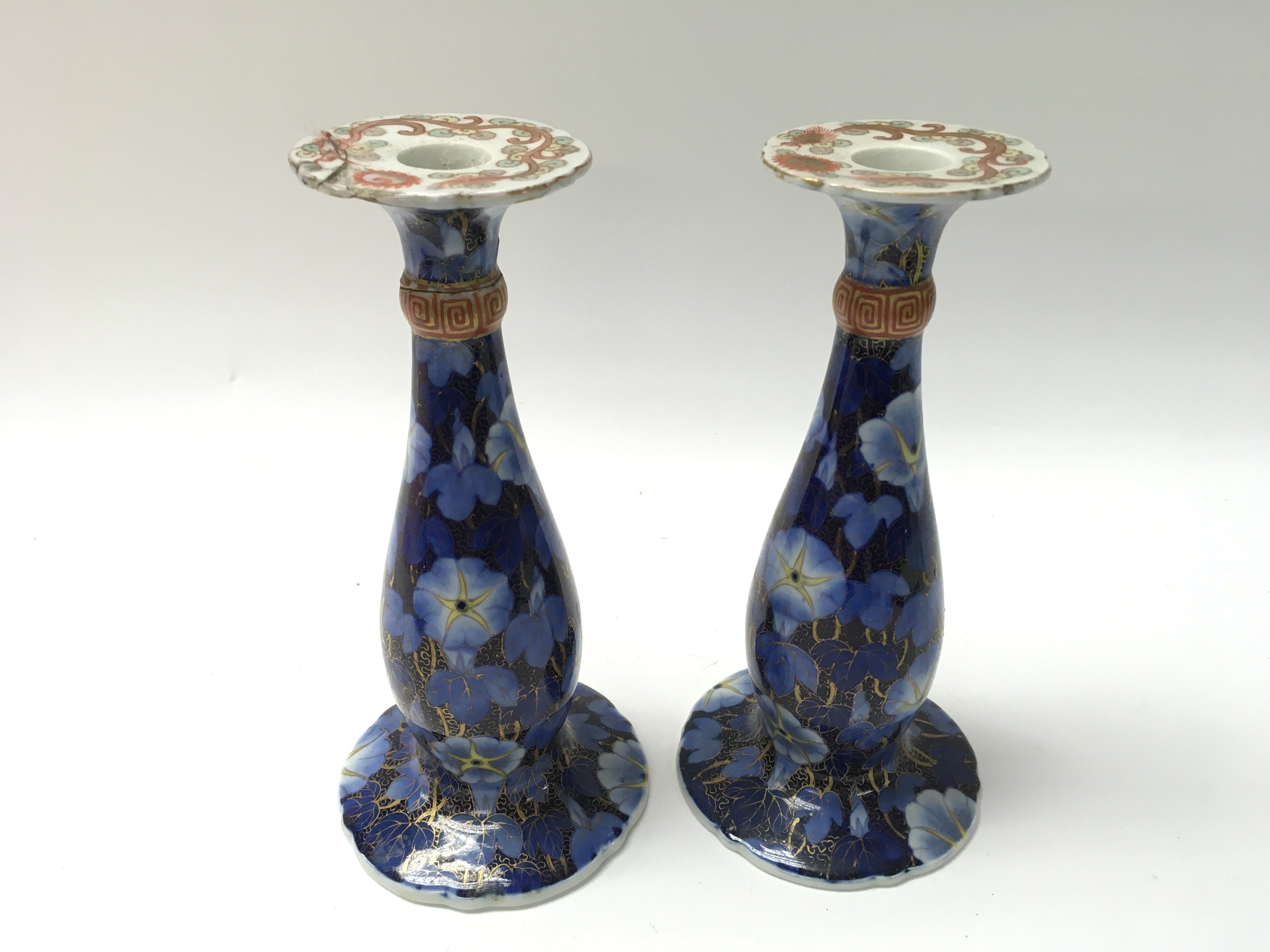 A pair of Japanese candle stick holders. One with