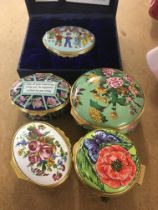 A collection of five Halcyon Days enamel pill boxes .