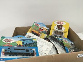 A box containing Thomas The tank engine locomotives wagons and carriages (a lot)