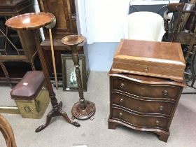 A reproduction bow fronted small mahogany chest of