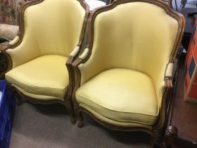 A pair of French walnut chairs in yellow upholster