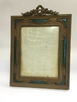 A French brass and enamel photo frame, approx 24cm x 33cm. Shipping category D.