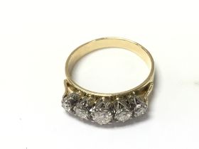 An 18ct gold illusion set 5 diamond ring. Size O a