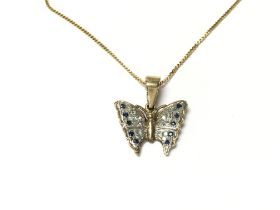 A 9ct gold chain with 9ct gold butterfly pendant.