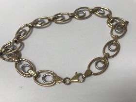 A 9 ct gold yellow and white gold bracelet . 7 grams.