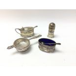 A collection of silver cruet items and strainer. B