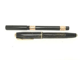 A vintage Parker 14k gold tipped Vacumatic and 192