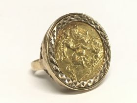 A Half Gold 1915 sovereign 9ct ring. Overall weigh