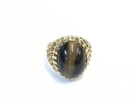 A gold clad ring inset with agate. 6.74 and size Q