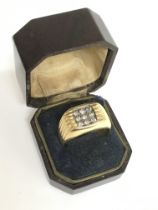 An 18ct gold signet ring set with diamonds , weigh