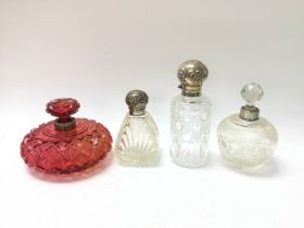 4 cut glass perfume bottles, two with silver stopp