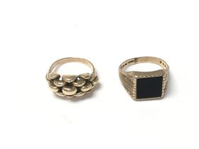 Two 9ct gold gents rings. Size L and N. Total weig