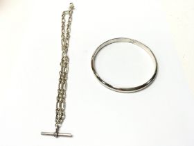 A silver slave bangle circa 1921 and a T bar watch