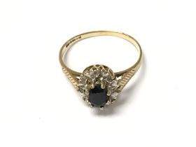 A 9ct gold ring set with black stone. 1.75g and si