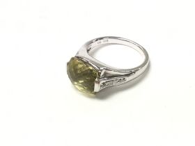 14ct white gold ring set with faceted citrine. Siz
