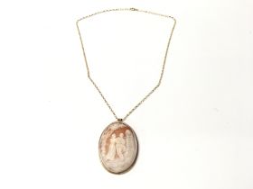 A 9ct gold cameo pendant on a 9ct gold chain. Tota