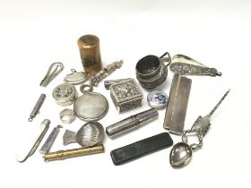 A collection of silver objects of virtue, includin