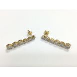 A pair of 18ct gold earrings set with round brilli