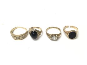 Four 9ct gold rings set with various stones includ
