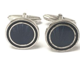 A pair of silver Dunhill cufflinks , postage categ