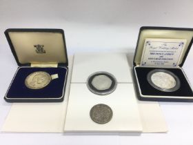 Four silver coins including Commemorative proofs.