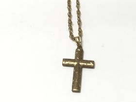 9ct gold cross on 9ct chain. 4.44g Postage A