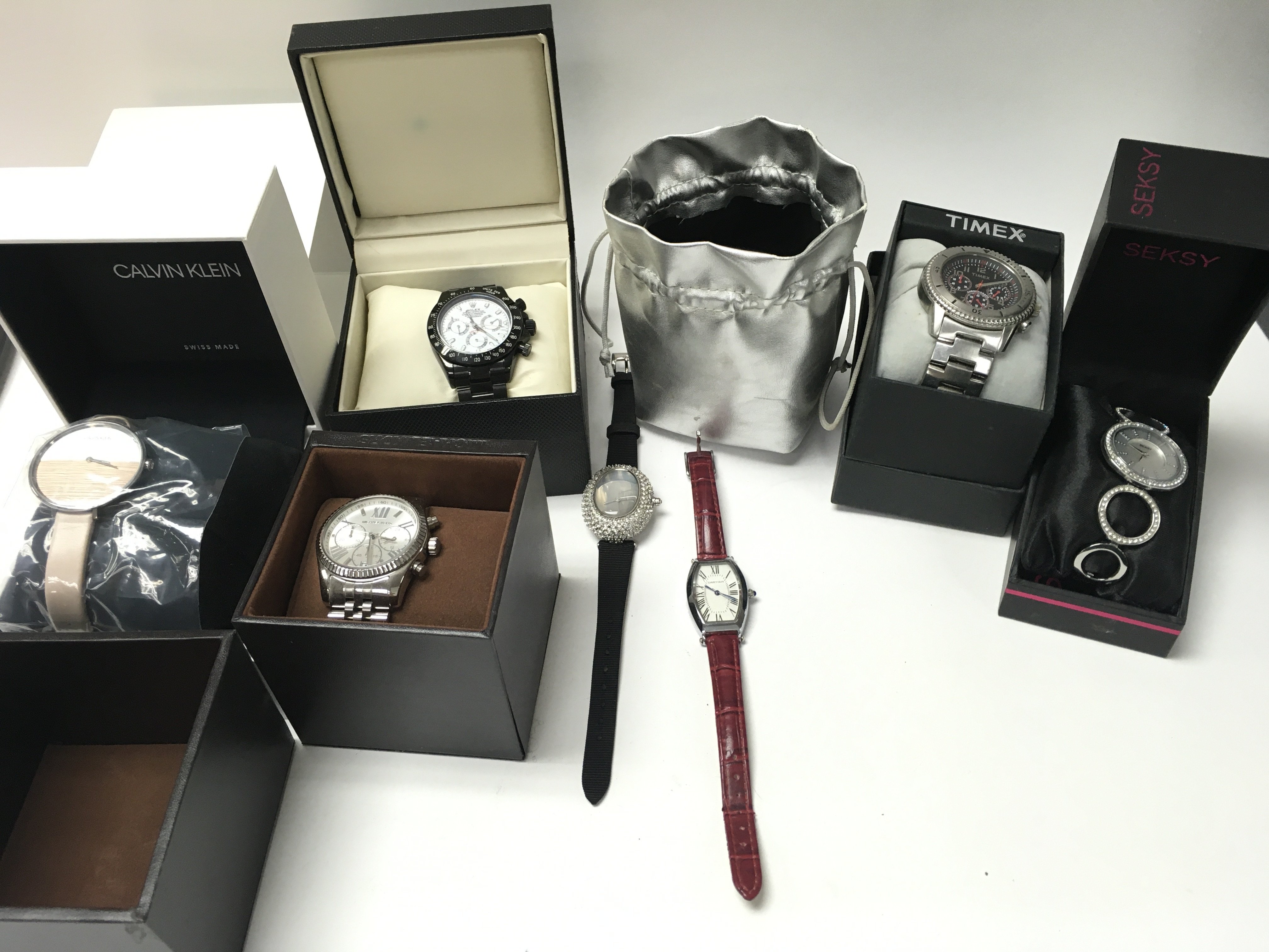 A collection of assorted dress and fashion watches
