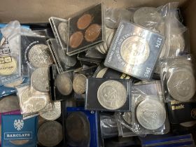 A collection of commemorative British coins, posta