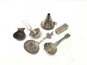 A collection of silver items including a caddie sp
