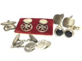 A collection of silver cufflinks, postage category